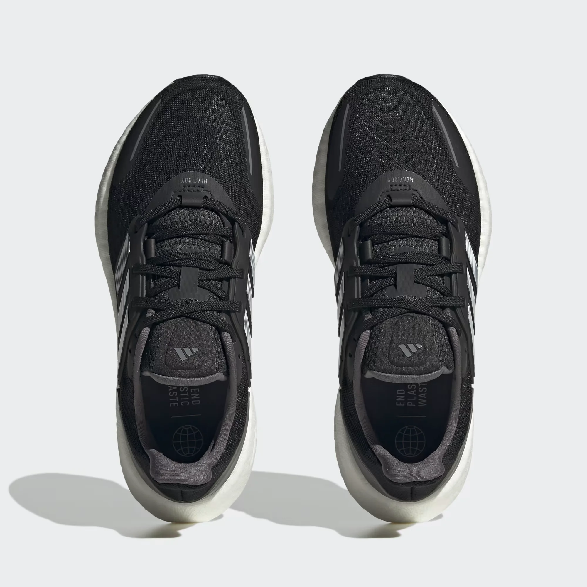 adidas pureboost 22 heat.rdy black white side view, adidas pureboost 22 mesh upper breathable design, adidas boost sole cushioning detail, adidas pureboost 22 outsole grip bottom, adidas pureboost 22 on feet running look men, adidas pureboost 22 heel cushioning close up, adidas pureboost 22 summer running shoes,
