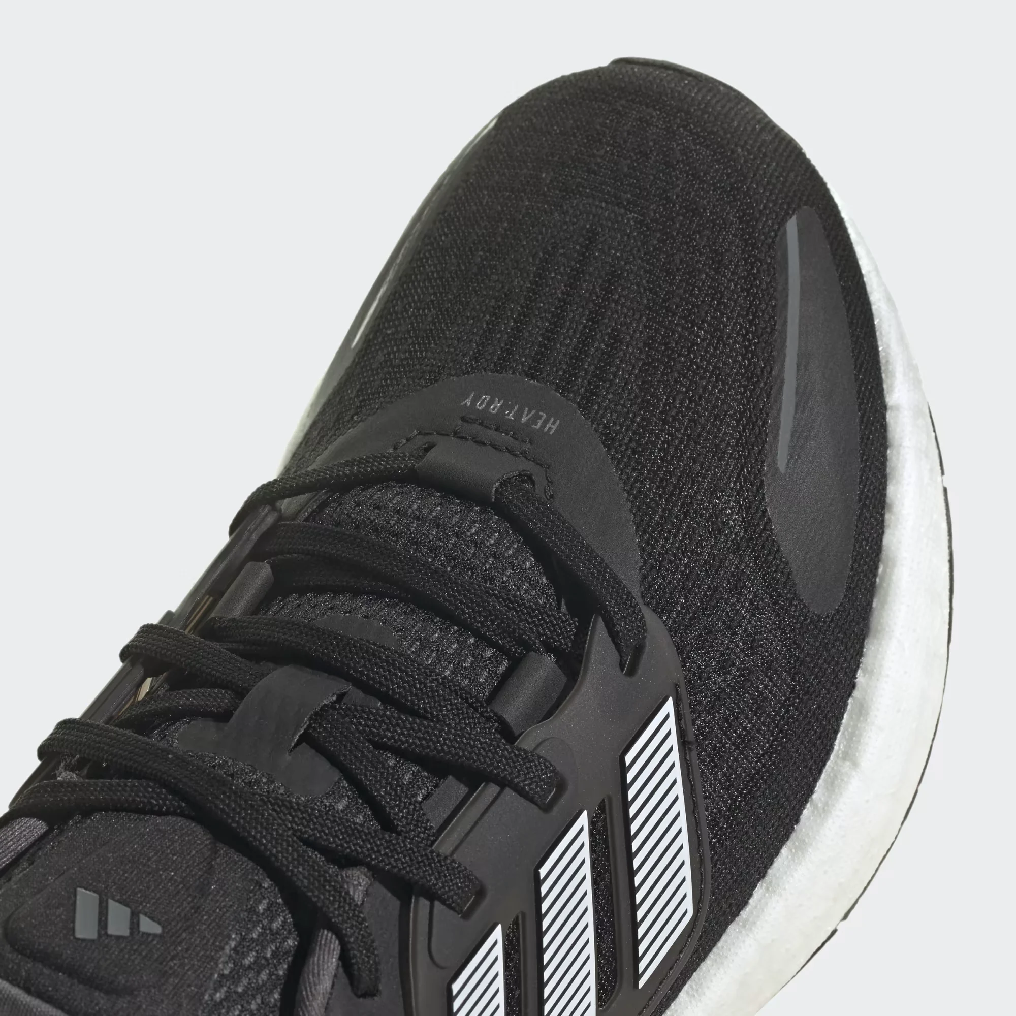 adidas pureboost 22 heat.rdy black white side view, adidas pureboost 22 mesh upper breathable design, adidas boost sole cushioning detail, adidas pureboost 22 outsole grip bottom, adidas pureboost 22 on feet running look men, adidas pureboost 22 heel cushioning close up, adidas pureboost 22 summer running shoes,