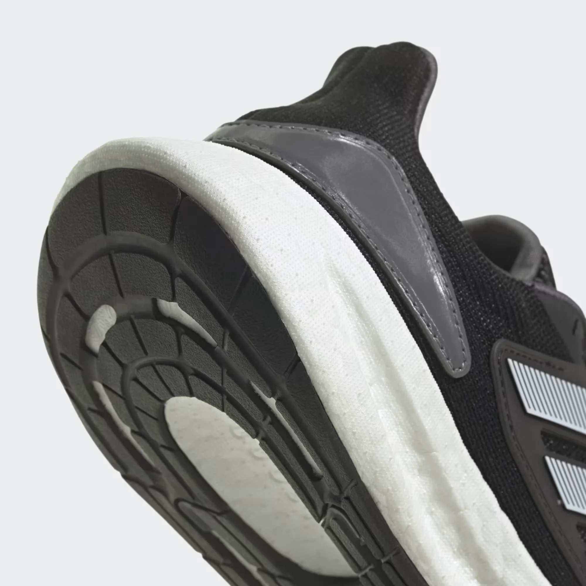 adidas pureboost 22 heat.rdy black white side view, adidas pureboost 22 mesh upper breathable design, adidas boost sole cushioning detail, adidas pureboost 22 outsole grip bottom, adidas pureboost 22 on feet running look men, adidas pureboost 22 heel cushioning close up, adidas pureboost 22 summer running shoes,