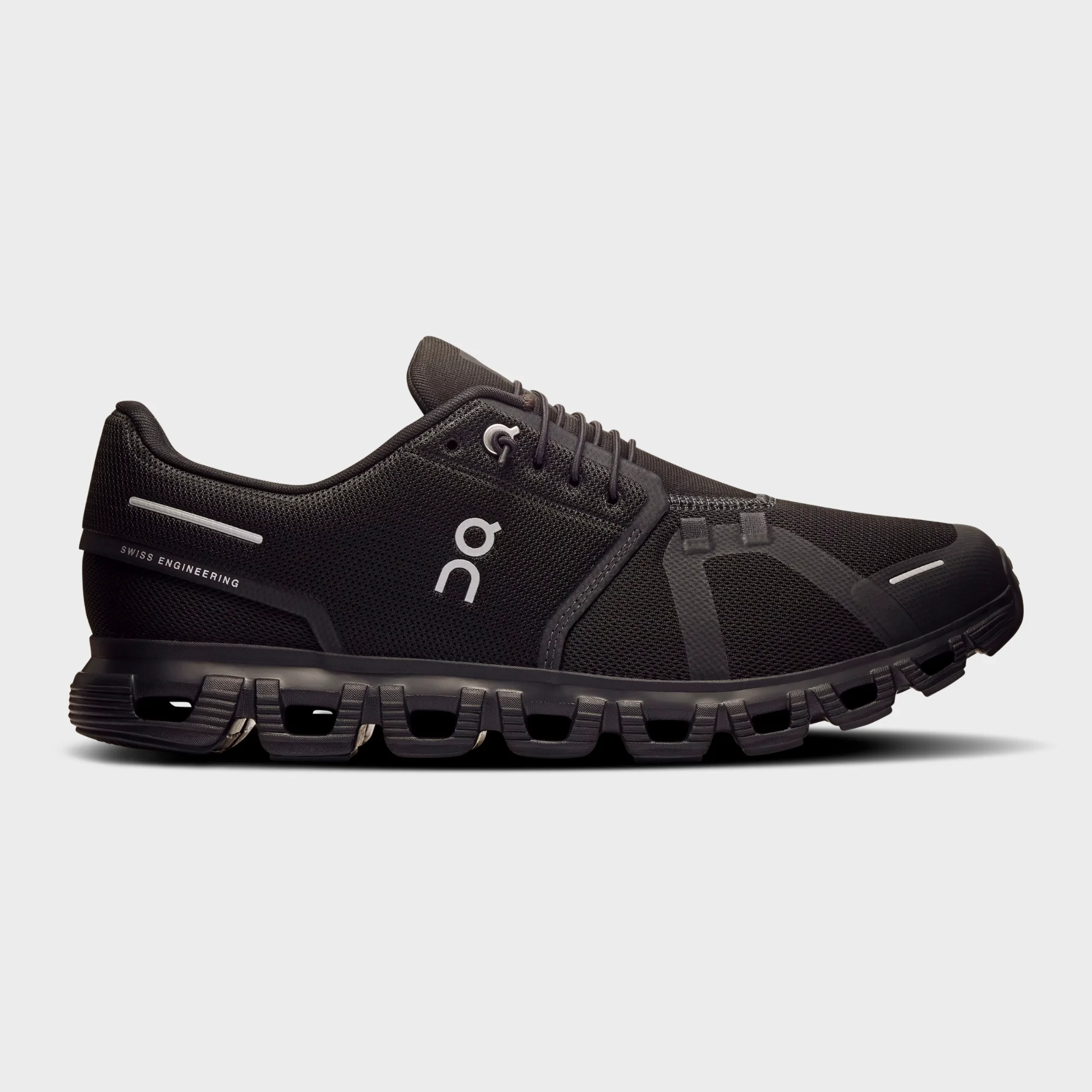on cloud 6 all black side view, on running cloud 6 black black, on cloud 6 triple black sneakers, cloudtec sole close up, on running black lifestyle shoes, on cloud 6 outsole detail, all black swiss running shoes, on cloud 6 on feet