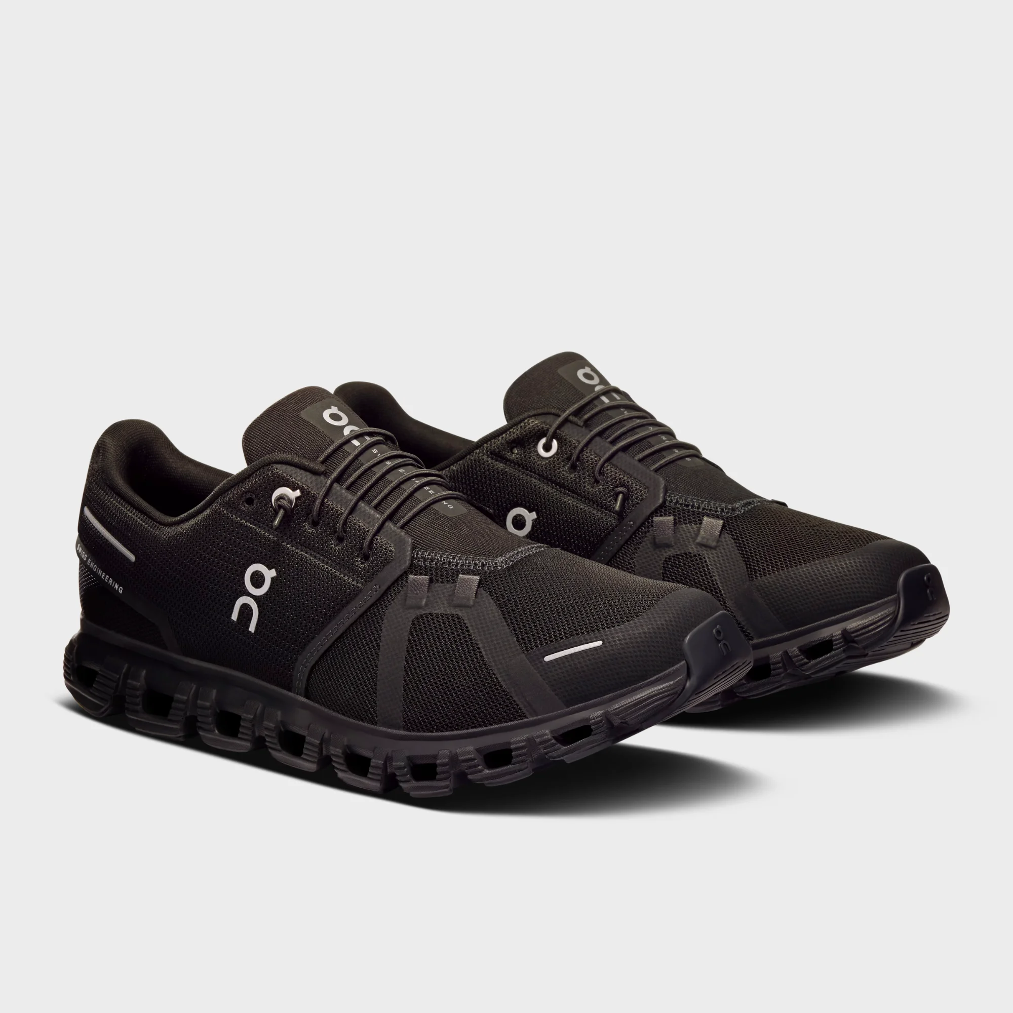 on cloud 6 all black side view, on running cloud 6 black black, on cloud 6 triple black sneakers, cloudtec sole close up, on running black lifestyle shoes, on cloud 6 outsole detail, all black swiss running shoes, on cloud 6 on feet
