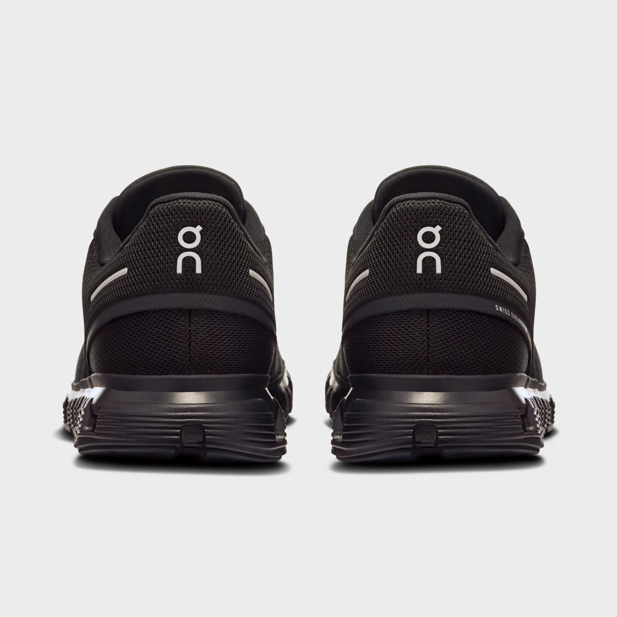 on cloud 6 all black side view, on running cloud 6 black black, on cloud 6 triple black sneakers, cloudtec sole close up, on running black lifestyle shoes, on cloud 6 outsole detail, all black swiss running shoes, on cloud 6 on feet