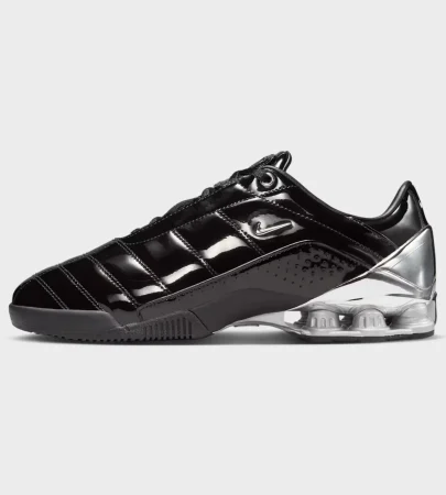 nike total 90 shox magia side view, nike total 90 black metallic silver, nike shox heel columns, nike total 90 quilted upper, nike total 90 mens sneaker, nike total 90 unisex sneaker, nike football lifestyle sneaker, nike total 90 on feet, nike shox outsole, nike total 90 profile, Nike Total 90 Shox Magia SP Black Metallic Silver men's sneaker, Nike Total 90 Shox Magia IM9326-001 side profile, Nike Total 90 quilted upper close-up, Nike Shox heel cushioning detail, Nike Total 90 lifestyle sneaker for men, Original Nike Total 90 Shox Magia Pakistan, Black Metallic Silver Nike T90 Shox on-foot view, Nike Total 90 retro football-inspired sneaker, Nike Total 90 rubber outsole detail, Nike T90 Shox Maha Amsterdam collaboration,