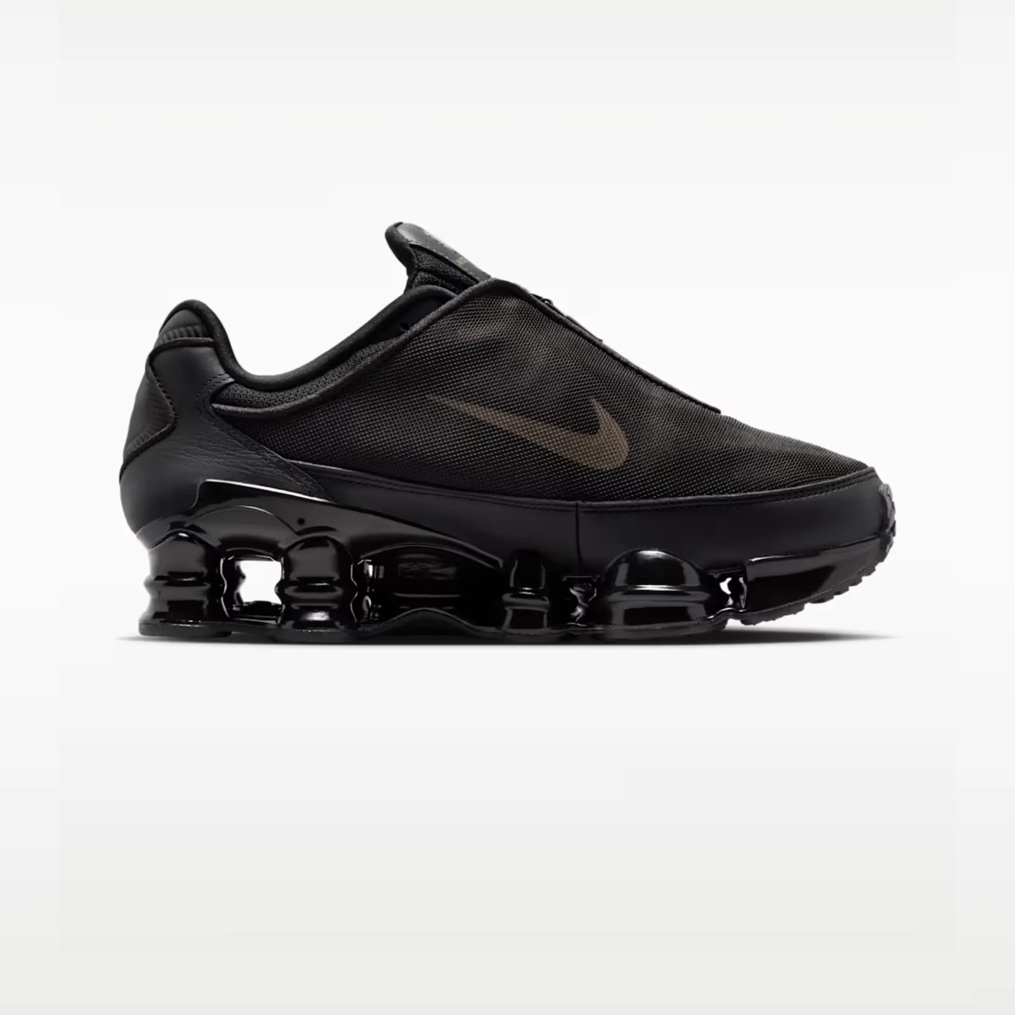 Nike Shox TL Black Cave Stone HM9612-010 Nike Shox TL Women's Shoes Black Cave Stone Nike Shox TL Black Side View Nike Shox TL Front View Nike Shox TL Rear View Nike Shox TL Full Length Shox Cushioning Nike Shox TL TPU Cage Upper Nike Shox TL Rubber Outsole Nike Shox TL Lifestyle Sneakers Original Nike Shox TL Pakistan